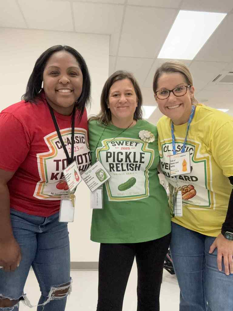 Three teachers on halloween in costumes