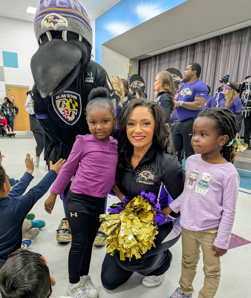Prek student with Ravens mascot