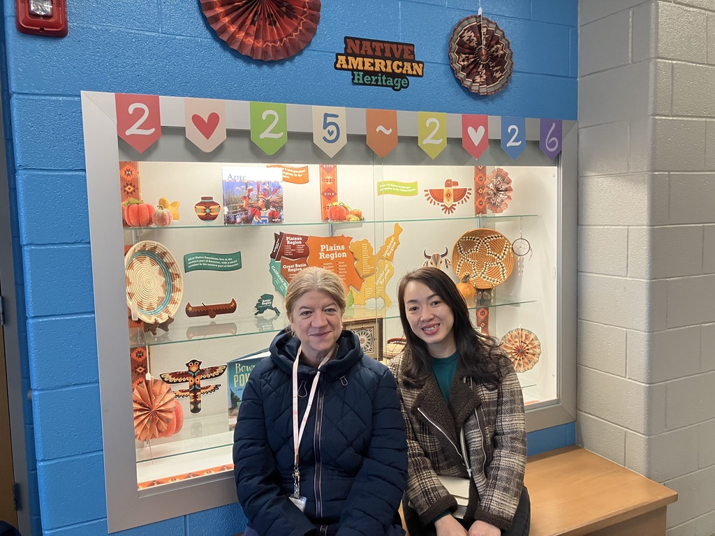 Bilingual Facilitators Angela Nambiar and Van Ngo Work together to support and welcome a brand new Quarterfield elementary student.