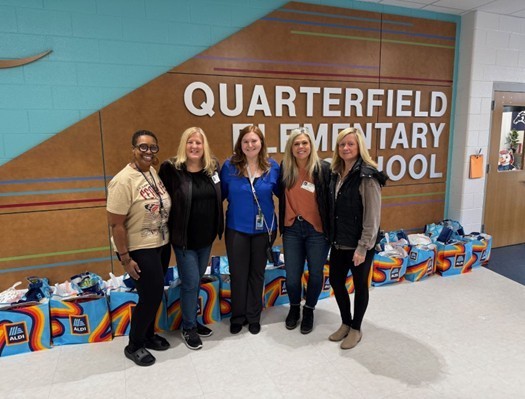Dennison and Carter posing with Thanksgiving meal