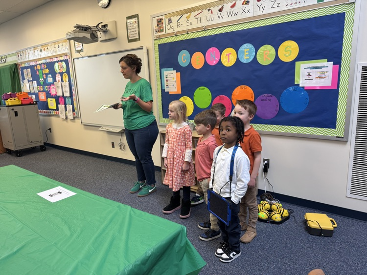 children giving awards to parent participants