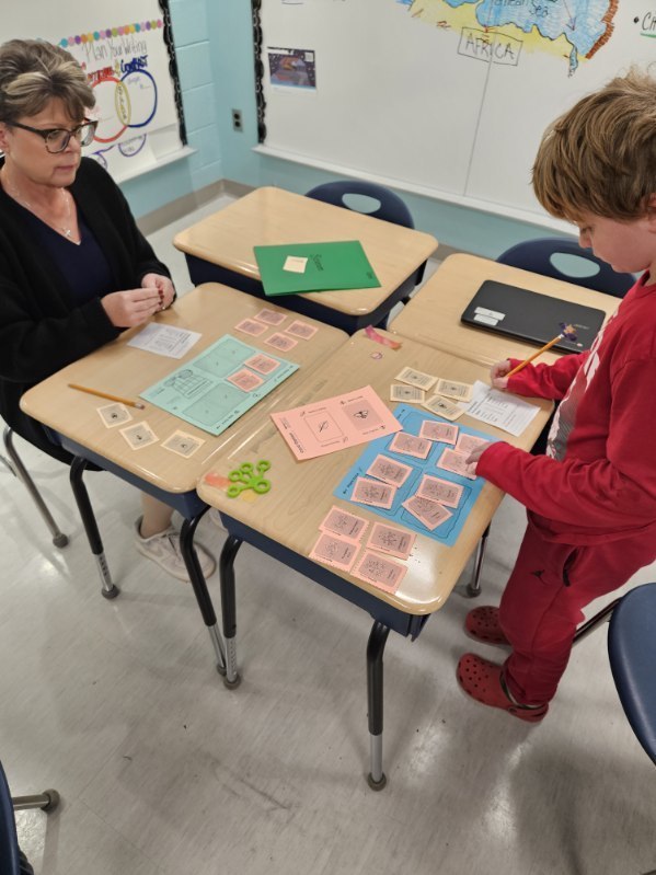 Mrs. Mouring and a student playing the Garden Game