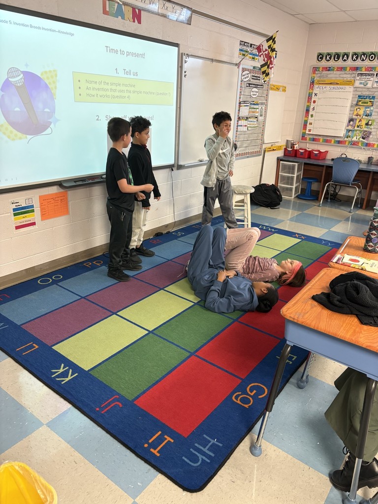 Students showing how simple machines work through dance. 