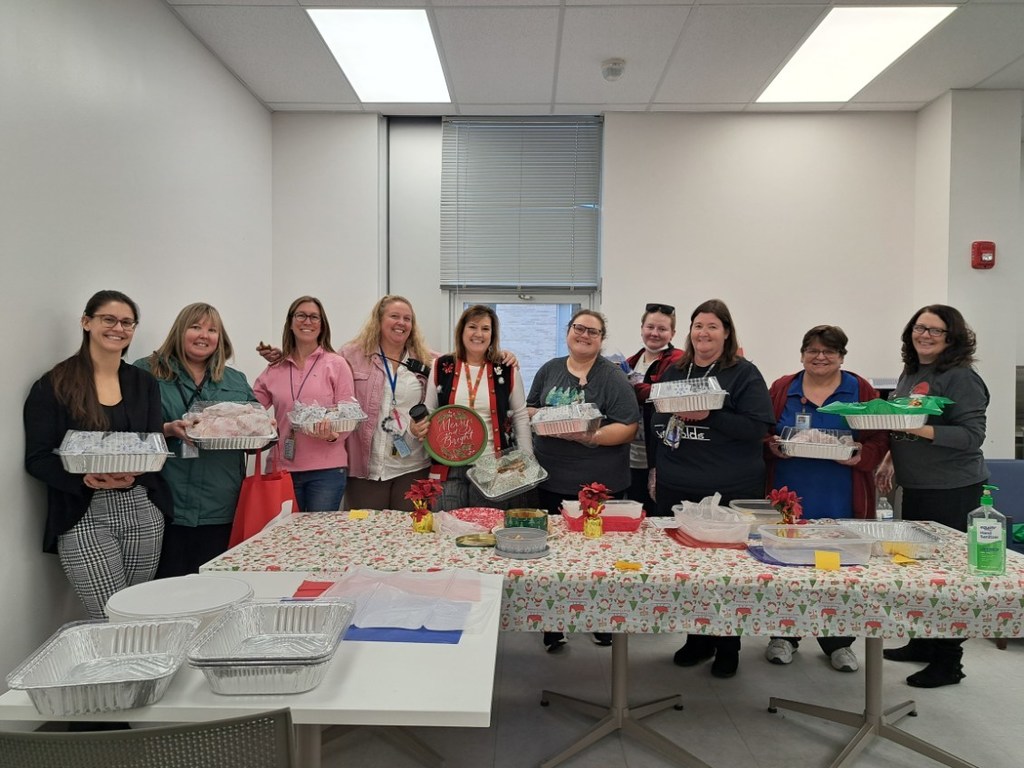 Photo of staff holding boxes of cookies