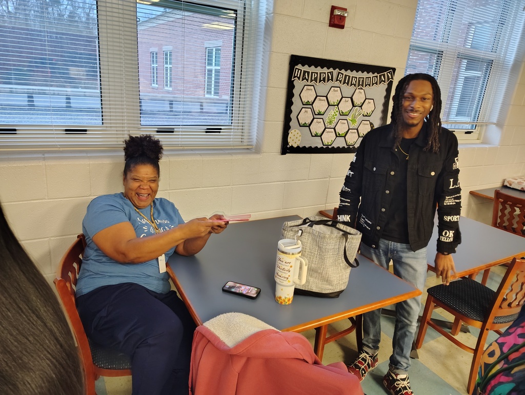 Staff members exchanging gifts