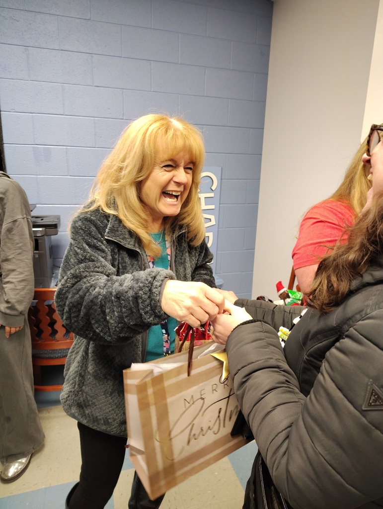 Staff members exchanging gifts