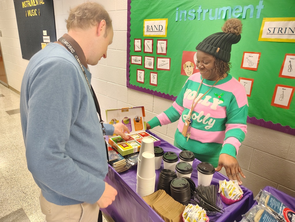 Principal and teacher discussing and picking tea