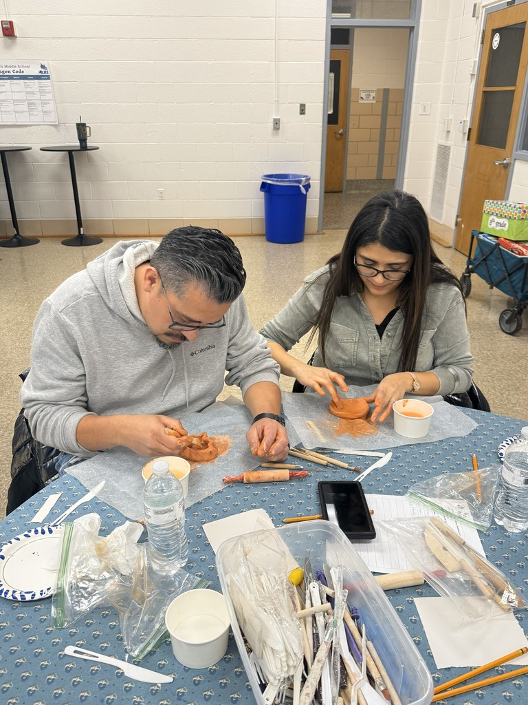 Parents doing pottery