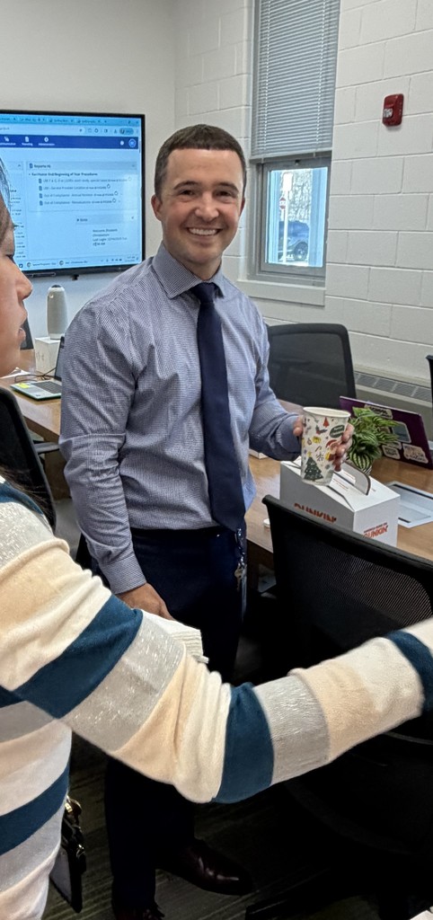 Principal Haslun serving hot chocolate