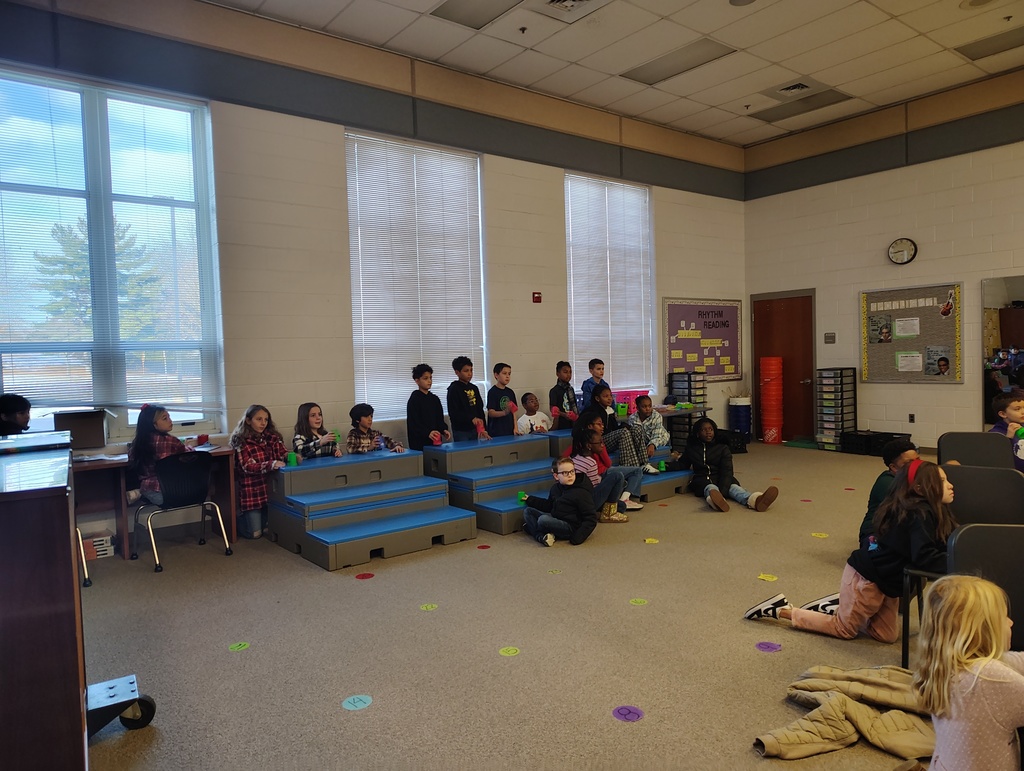 students in a music room with cups