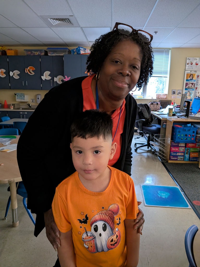 Staff and student in orange clothes
