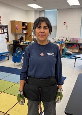 Photo of Mrs. Ruiz- night time custodian in classroom
