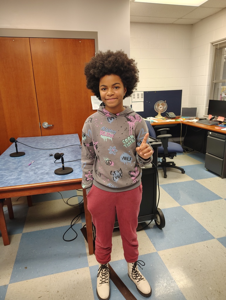 Our champion holding up number one!