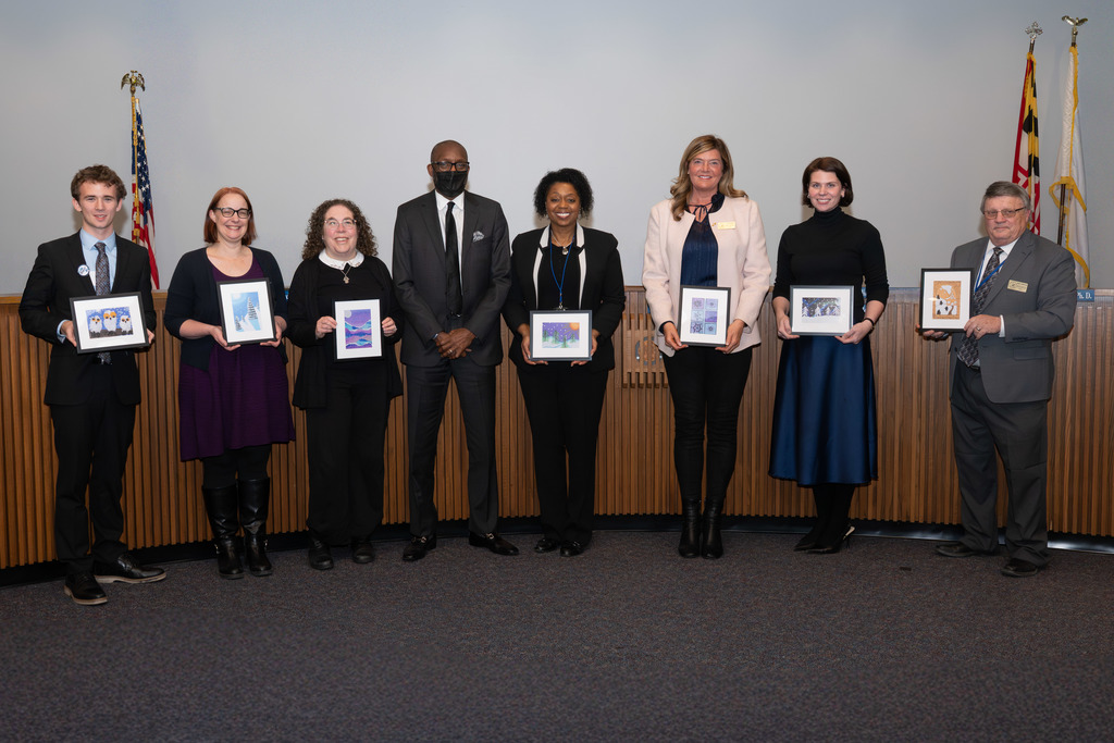 Boarda Members with student artwork