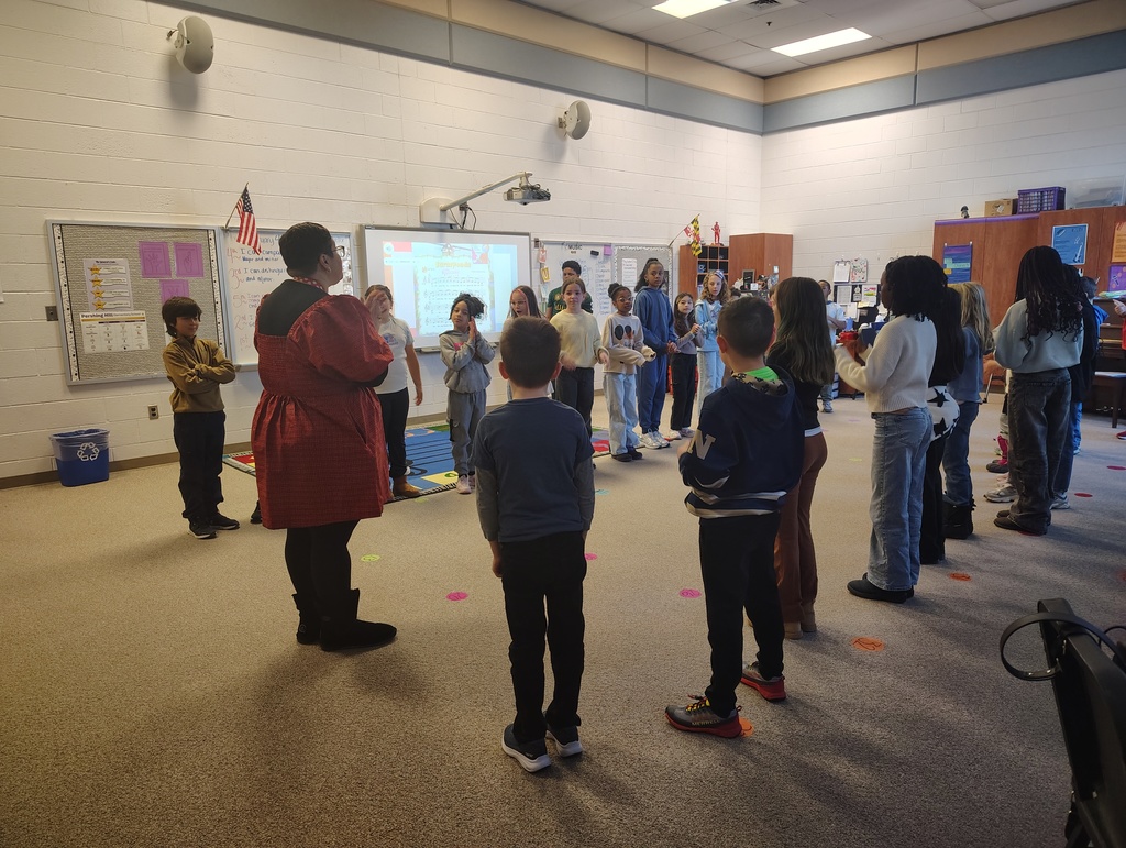 Students in two lines as the teacher teaches the dance routine