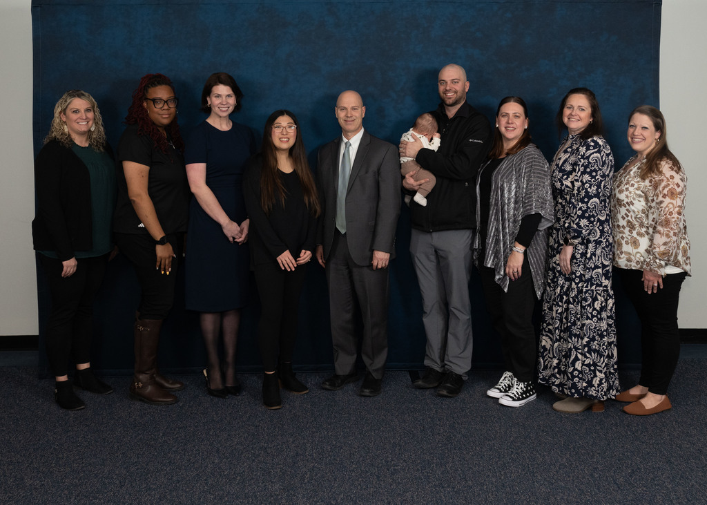 Family members, staff, and boardmember with Educator of the Month – Rebekah Thompson, Four Seasons Elementary School