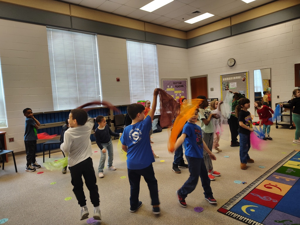 students playing with scarves