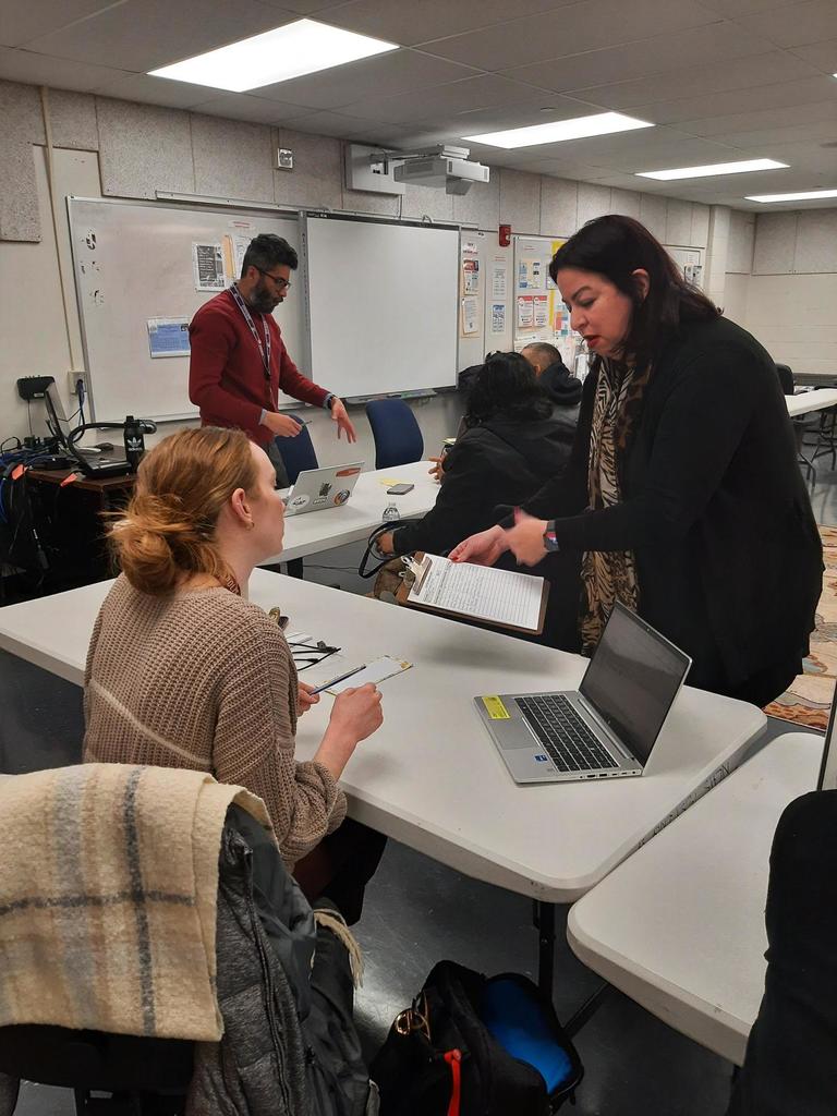 School and Family Partnerships team in action helping families complete the application for CAT-North