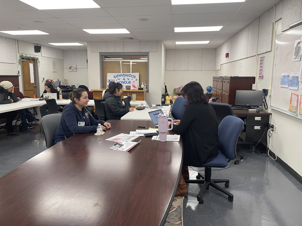 School and Family Partnerships team in action helping families complete the application for CAT-North