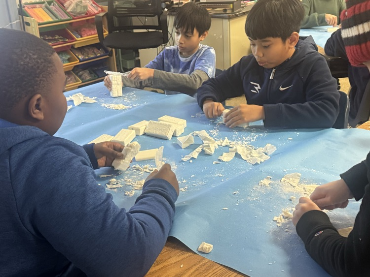 students carving bars of soap