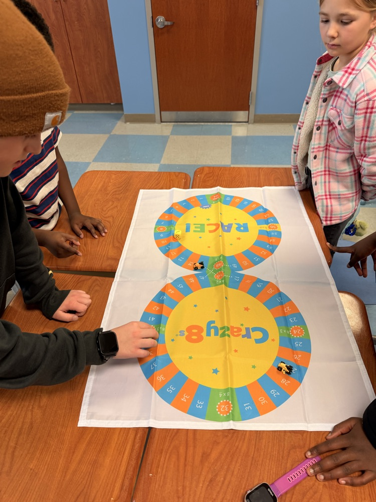 3rd - 5th grade Math Club students playing the Crazy 8’s race! To race around the game board students were decomposing numbers, adding, and reviewing multiples of 8!