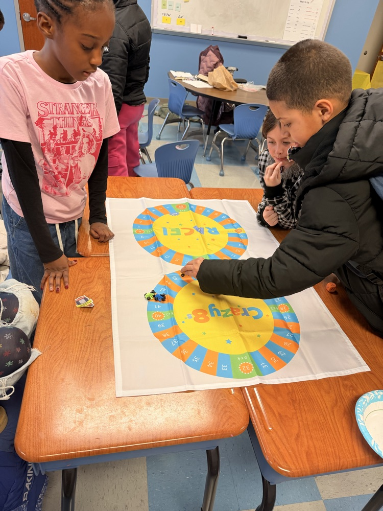 3rd - 5th grade Math Club students playing the Crazy 8’s race! To race around the game board students were decomposing numbers, adding, and reviewing multiples of 8! 