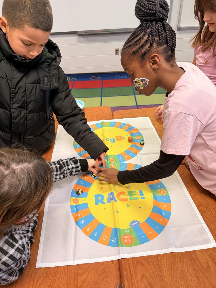 3rd - 5th grade Math Club students playing the Crazy 8’s race! To race around the game board students were decomposing numbers, adding, and reviewing multiples of 8! 