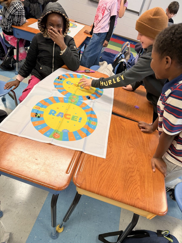 3rd - 5th grade Math Club students playing the Crazy 8’s race! To race around the game board students were decomposing numbers, adding, and reviewing multiples of 8! 