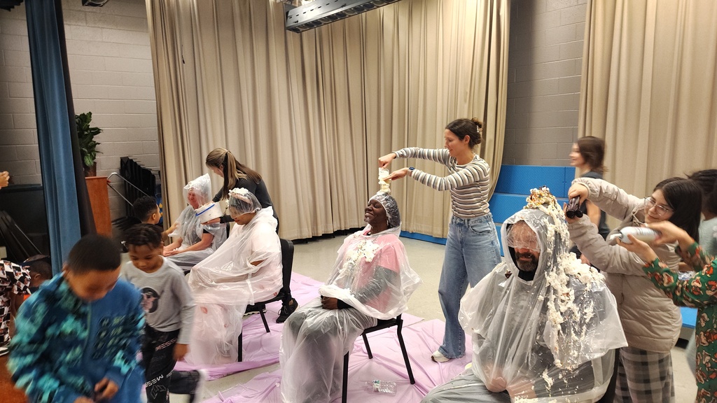 people putting toppings on their sundaes