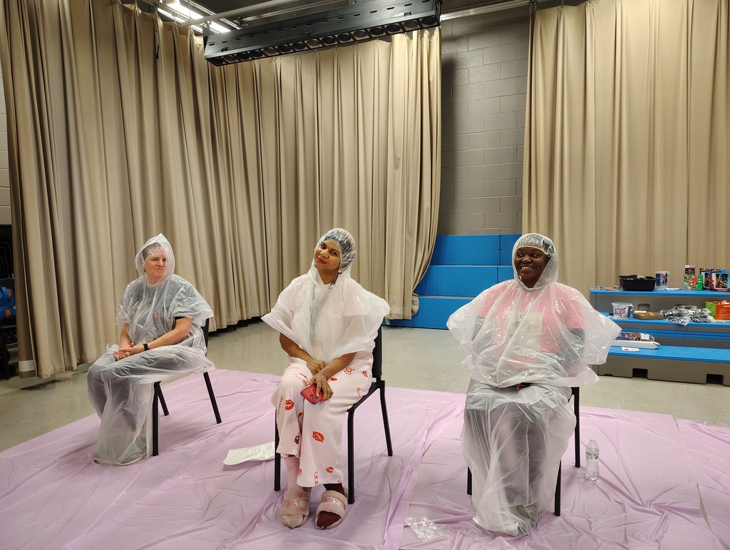 3 staff members win ponchos and head caps