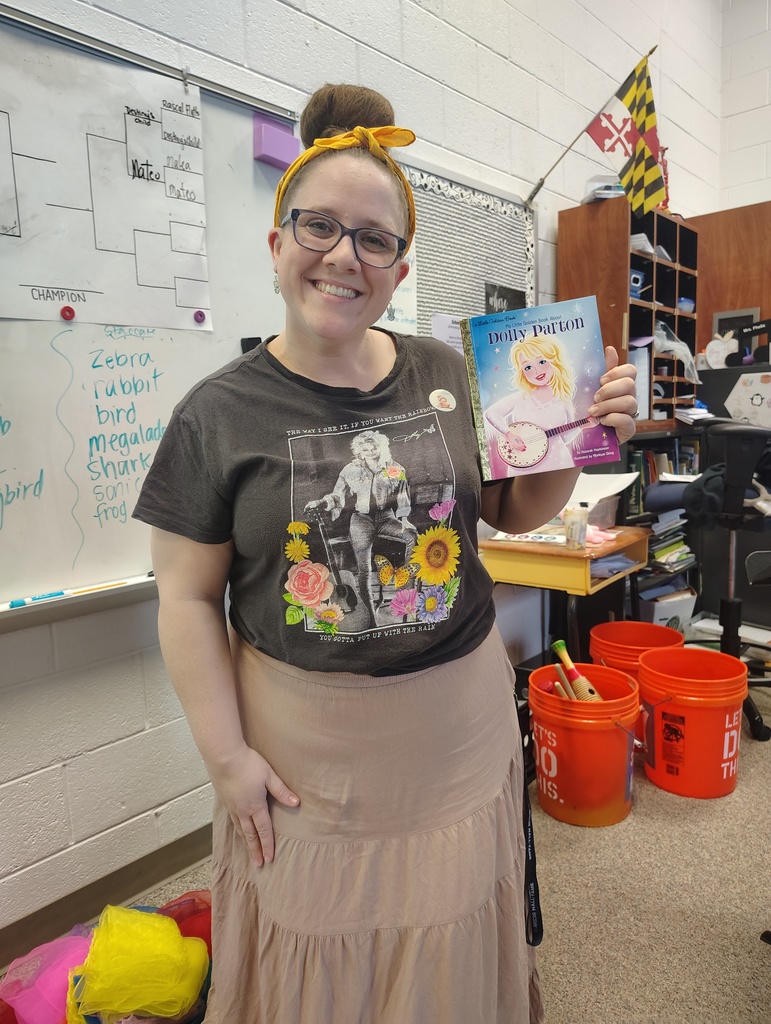 teacher with dolly parton book