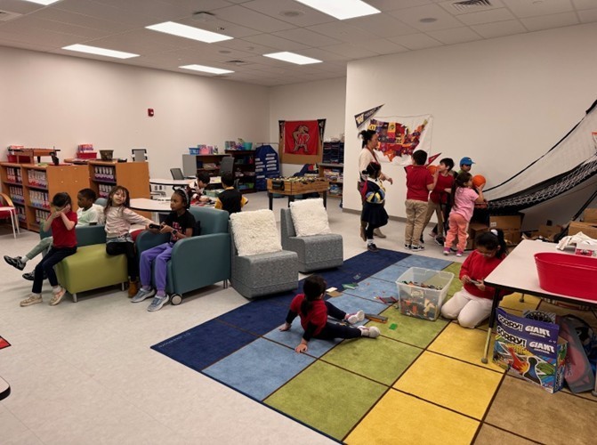 Photo of AVID dorm room with students playing games