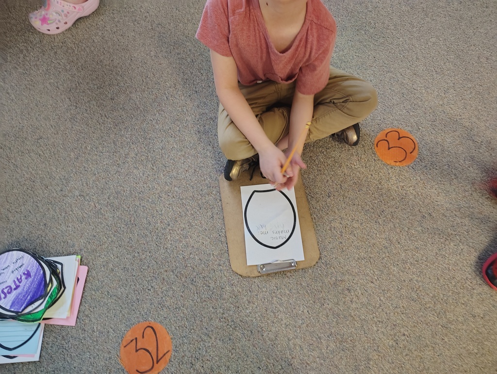 student working on his flower petal