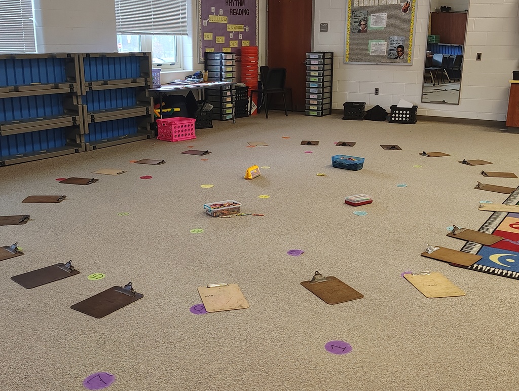 the set up of the classroom with clipboards in a circle