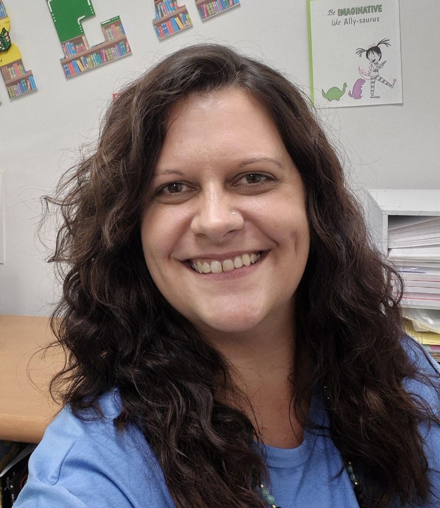 Photo of Ms. Sanchez- Media Asisstant standing in classroom