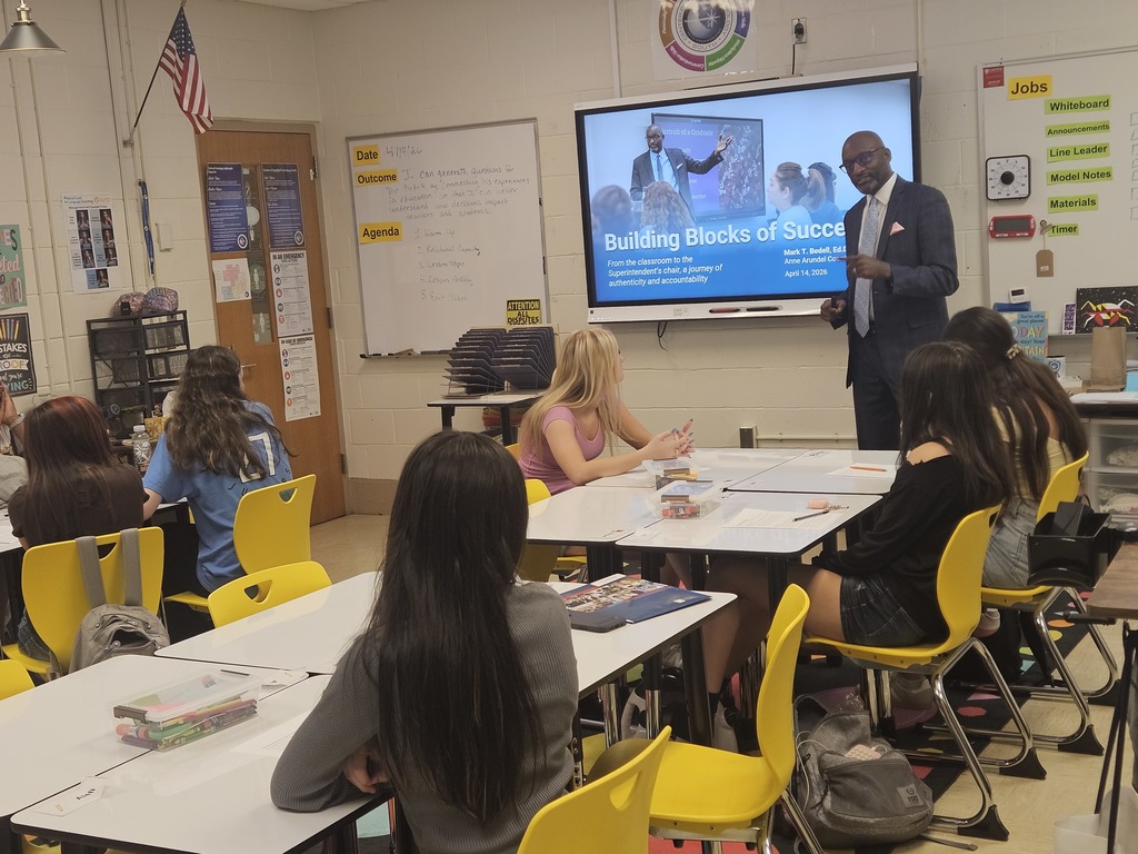 Dr. Bedell speaks to students in a classroom