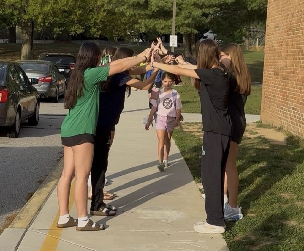 Arundel High atheltes greet girl student