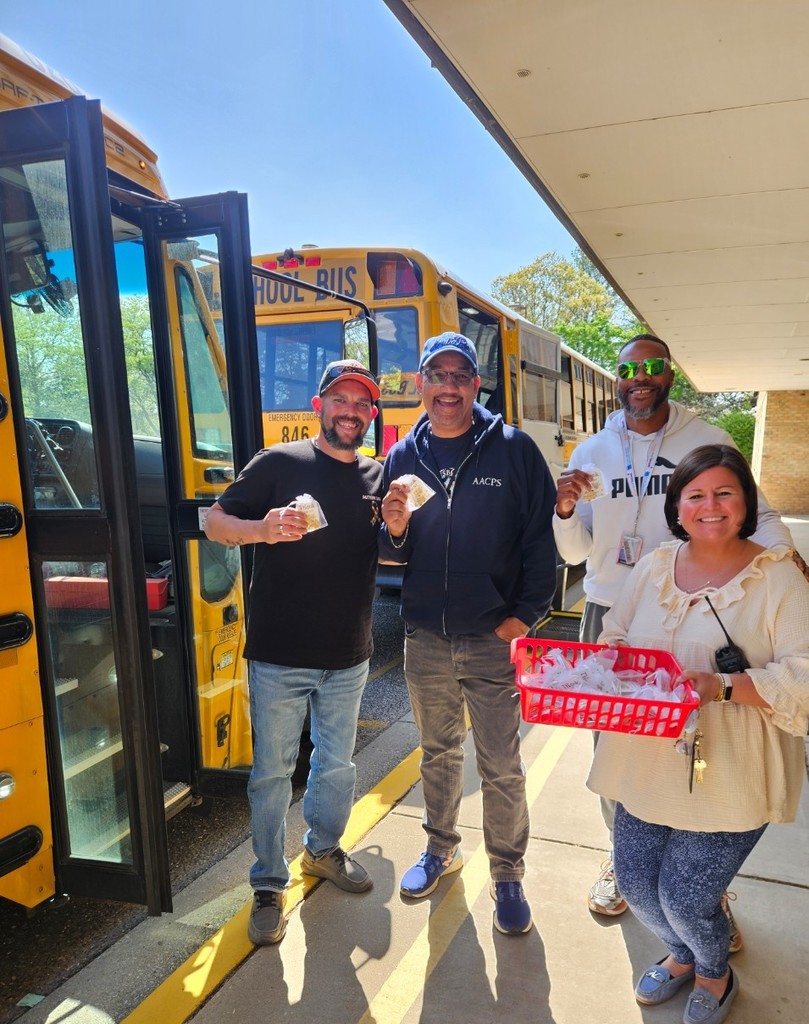 four people standing 