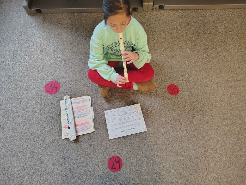student practicing recorder