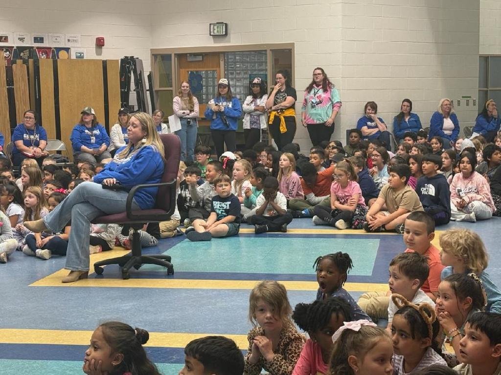 Principal Lauren Wickline surrounded by students