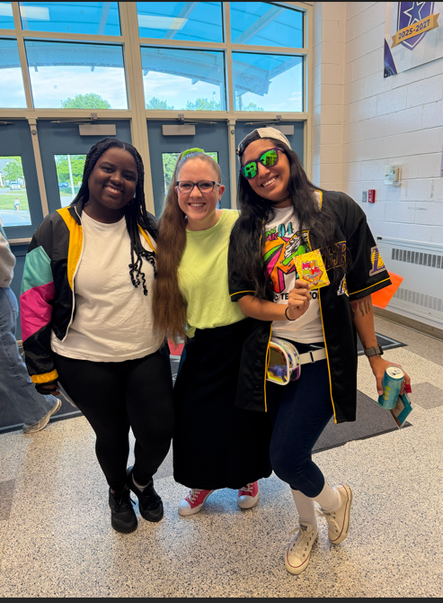 3 teachers posing for a picture in 90s gear