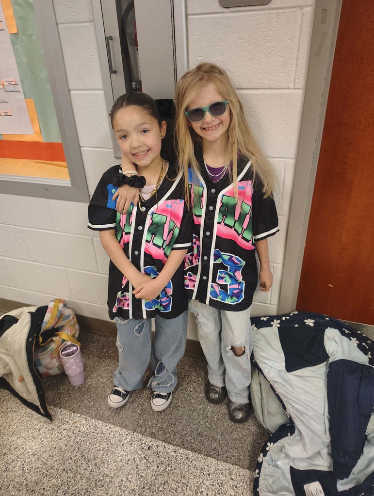 2 students rocking 90s hip hop style shirts