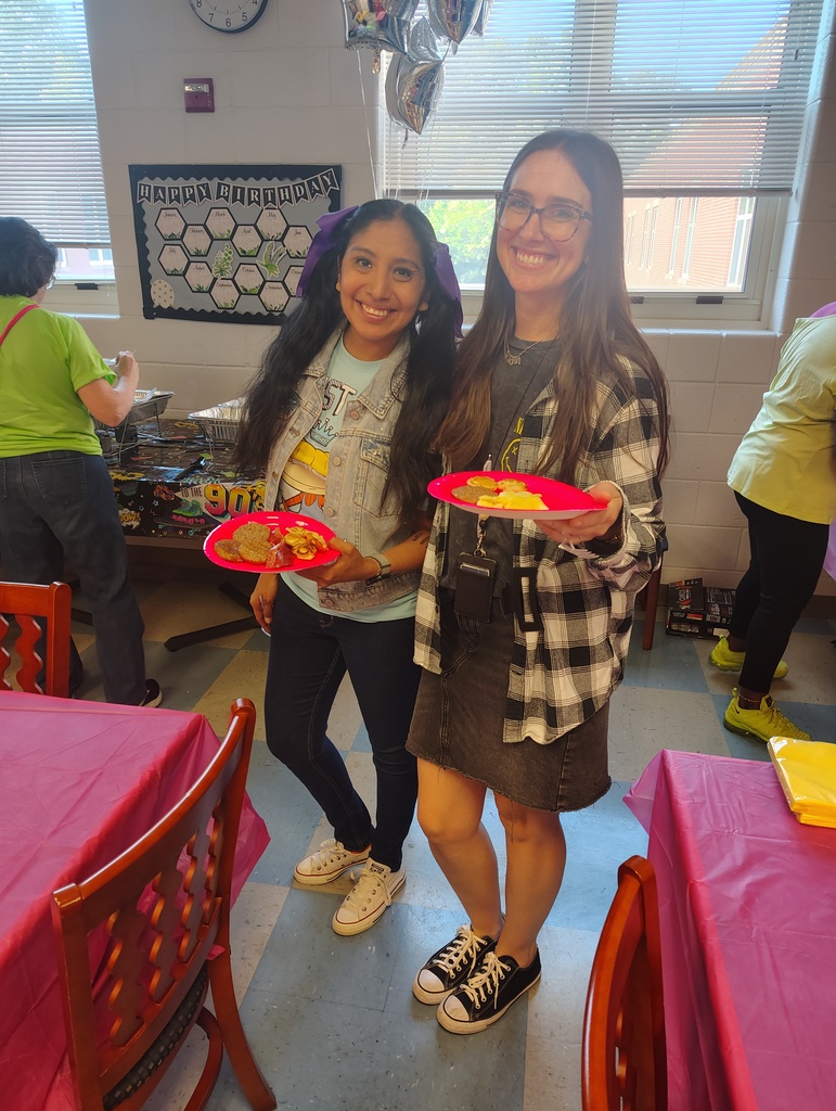 2 teachers posing with breakfast