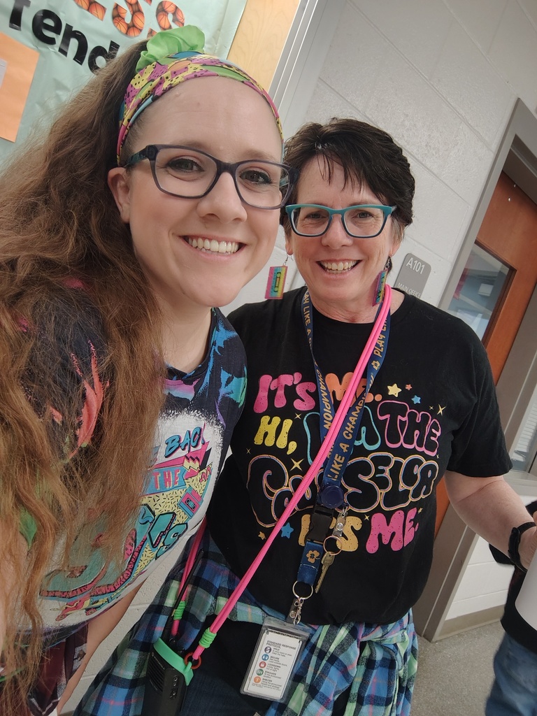2 staff members rocking 90s gear