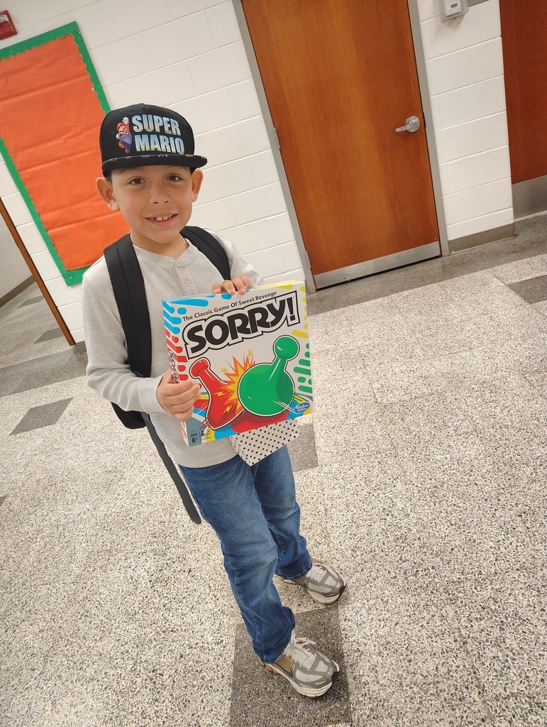 a student holding the game Sorry