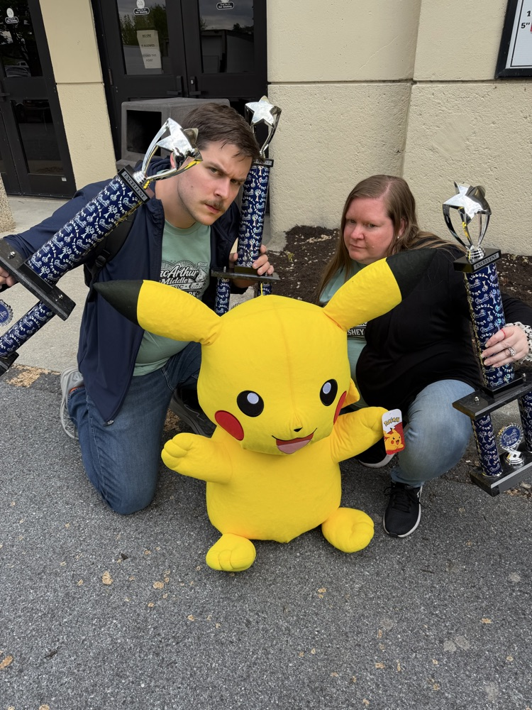 teachers with trophies and pikachu