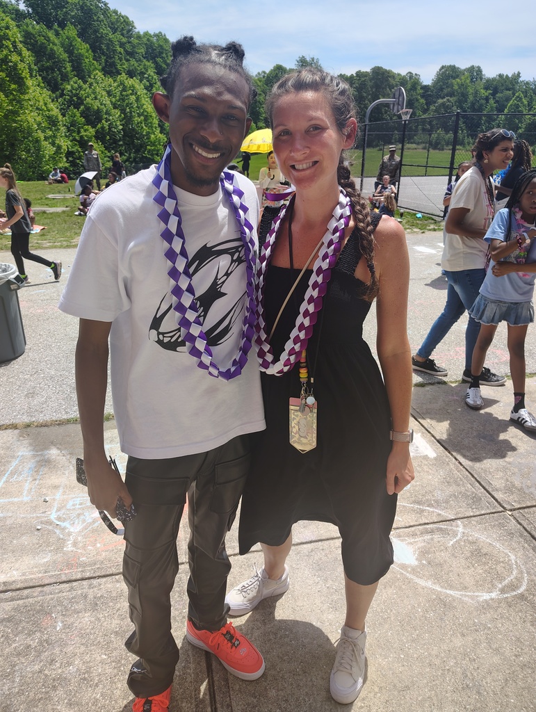 2 4th grade teachers showing off their handmade leis