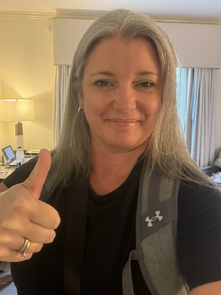 Principal Hamlin smiling with a thumbs up