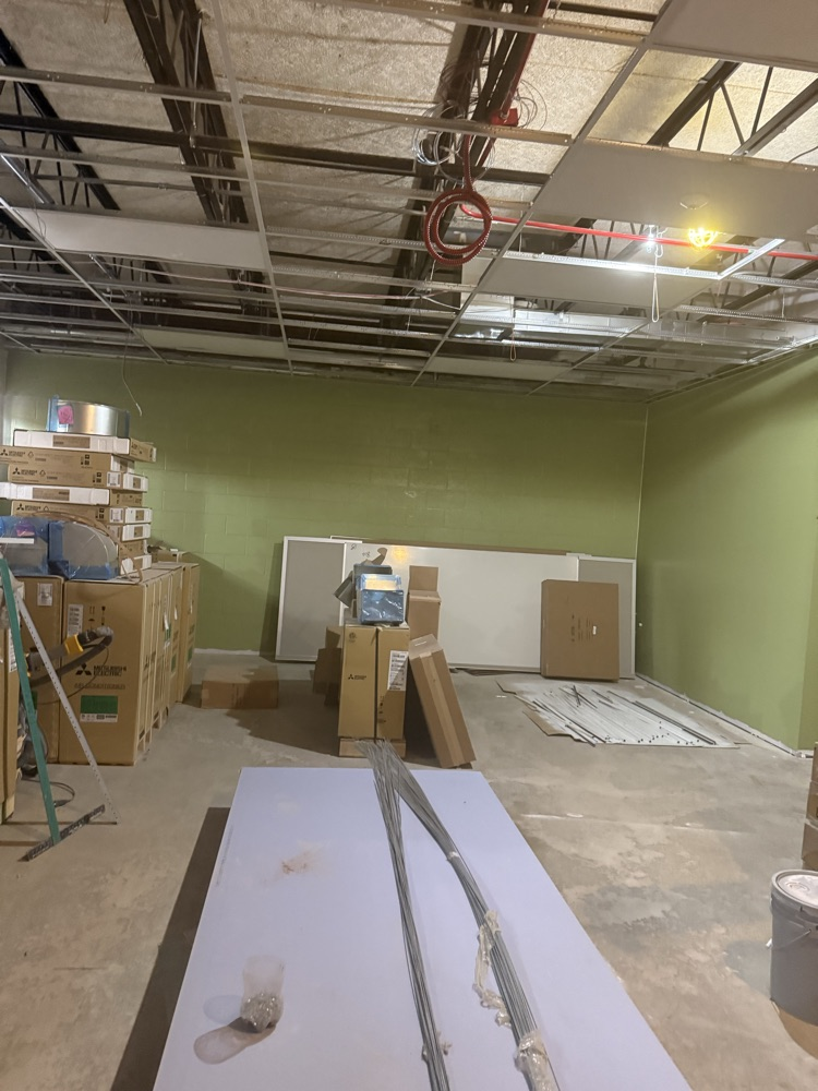 classroom under construction with green paint