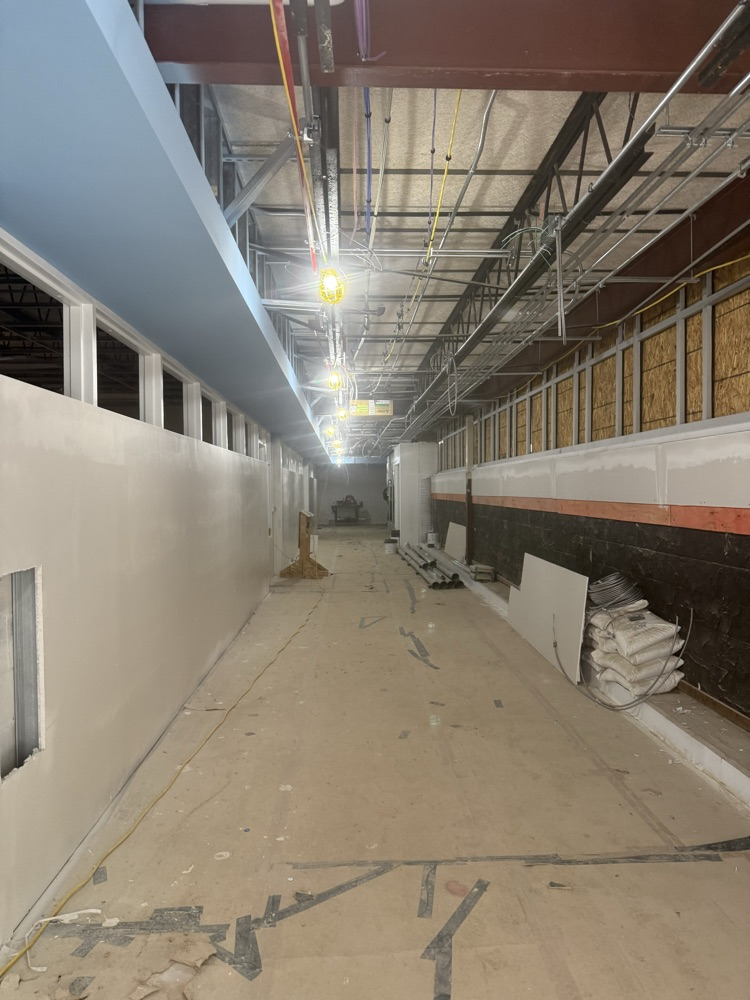 hallway under construction with blue paint